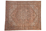 Distressed vintage Persian Mehrivan carpet, serrated geometric medallion in dusty blush, ivory, seafoam green.