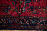 Close-up of the fine curvilinear floral patterns on this vintage Persian Lilihan rug.