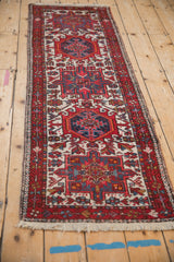 Close-up of vintage Karaja runner's geometric floral design and checkerboard border.