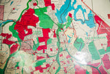 Close-up of the Westchester pull down map with Valhalla, Kensico Reservoir, in bright red, aqua, ivory.