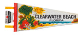 Vintage felt pennant's left side with souvenir tag, yellow ties, and stitched red border.