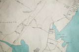 Section of the Portland, Maine map displaying Falmouth, blue coastlines, roads, and water damage.