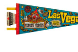 Close-up of the red stitched binding and attached souvenir tag on the vintage Circus Circus pennant.