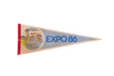 Vintage Expo 86 Vancouver felt flag pennant with a colorful retro graphic and blue lettering.