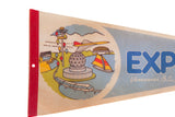 Detailed view of the vintage Expo 86 graphic scene and red felt binding.