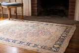 Fine antique Tabriz rug's cypress tree border and field with soft blue striations.