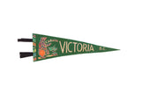 Vintage Victoria BC Canada felt pennant in green with a colorful graphic of a bear.