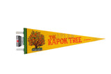 Vintage The Kapok Tree Florida pennant in yellow felt with a colorful tree illustration.