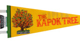 Close-up of the vintage pennant's Kapok Tree graphic and green stitched souvenir tab.