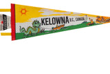 Close-up of the Kelowna felt pennant's red stitched edge with 'Souvenir Pennant' label.