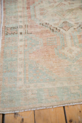 Even wear on a distressed Oushak rug showing visible knot heads and low pile texture.