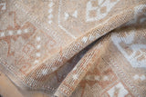 Hand knotted vintage Melas rug pile showing distressed texture and even wear.