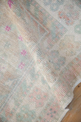 Even wear across the knot heads of a vintage distressed Turkish Oushak rug.