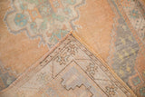 Folded view revealing the distressed pile, original side cord, and reverse foundation texture.
