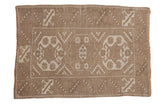 Distressed hand-knotted Melas rug with triple medallions, serrated floral border, oxidized silver and ivory tones. 2'8