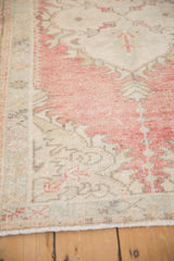 Even wear across the knot heads and low pile of a distressed vintage Oushak rug.
