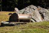 Little Mod Sidecar bench in natural white maple, shown in a wide, sunlit view.