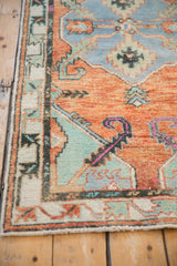 Vintage Oushak rug detail: terracotta field, faded turquoise motifs, and even low pile wear.