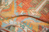 Hand-knotted texture of a vintage Turkish Oushak rug in rust, saffron, and turquoise green.