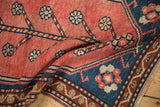 Vintage Oushak mat: folded blush field, germinating tree motif, geometric blue border.