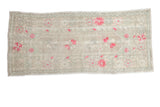 Distressed vintage Oushak runner with pink floral blossoms on a soft ivory and sea foam green field.