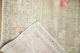 The hand-knotted foundation and weave on the reverse corner of a distressed Oushak rug.