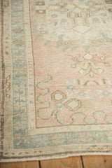 Vintage Distressed Oushak runner: side selvage, worn dusty rose field and slate blue border.