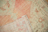 Detail of the hand-knotted foundation and secured side cord of a vintage Turkish rug.