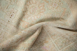 Hand-knotted texture of a vintage Turkish rug showing even wear to the knot heads.