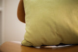 Muted lime green corduroy backing with ribbed texture on the Antique Turkish rug pillow.