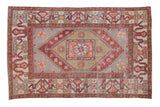 Vintage Oushak distressed carpet with a stepped medallion design in muted copper, sage, and silvery gray.