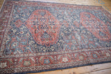 Visible wear revealing distressed finned contour floral motifs on the Sparta rug.