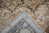 Vintage Turkish Heriz rug corner showing geometric pattern, machine-bound edge, and woven foundation.