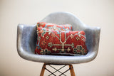 Vintage Persian rug pillow with deep red, blue, green, and cream botanical patterns. 8x14 inches.