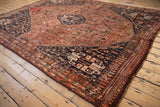 Vintage Qashqai carpet corner: madder root border, pale tangerine accents, intact selvage.