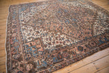 Close-up of the vintage Mehrivan rug corner, showing the brown border and intact side cord selvage.