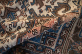 A fold in the vintage Mehrivan carpet reveals the dense, hand-knotted short pile.