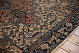 Vintage Mehrivan rug border with navy turtle samovar motif and dusty terra cotta field.