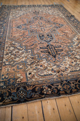 Vintage Mehrivan carpet's main border featuring navy blue turtle samovar motifs and soft fringe.
