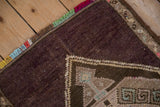 Secured selvage with colorful rainbow fringe on a distressed Turkish Kars rug corner.