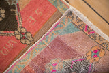 Vintage distressed Kars rug reverse weave detail, showing vibrant pile and intact fringe.