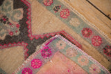 Reverse view of a Turkish Kars rug showing the hand-knotted weave and secured side cord.