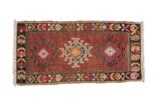 Vintage distressed Kars rug mat, geometric medallions in copper, silver, charcoal, and magenta.