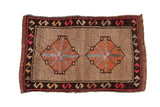 Distressed Kars rug mat with double copper medallions on beige, charcoal serpent border, magenta.