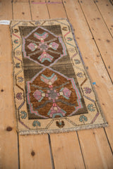 Meandering vine border and quatrefoil motifs on the abrash ground of a vintage Kars rug.