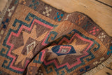 Textural hand-knotted pile on a folded vintage Kars rug, with geometric patterns.