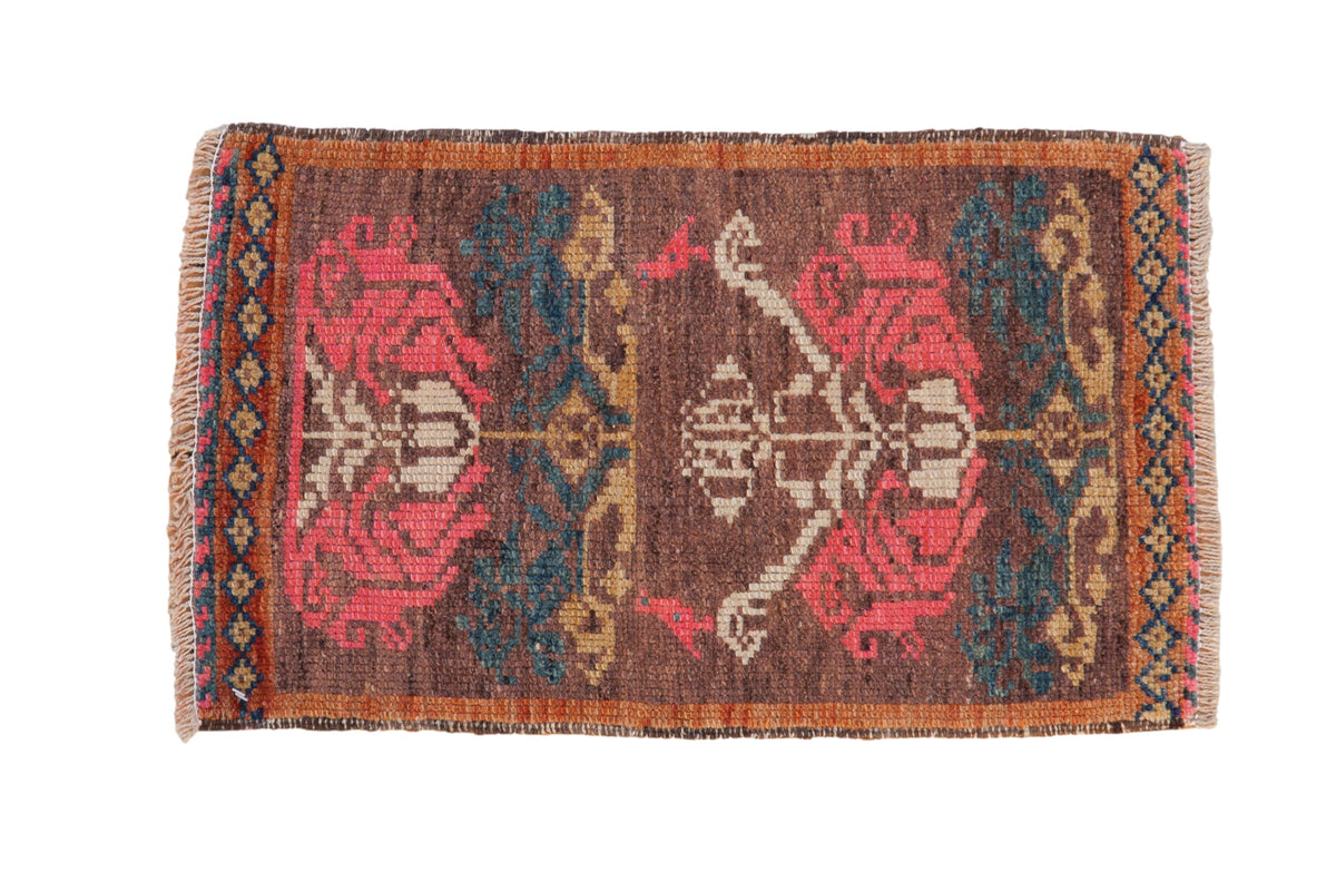 Distressed Turkish Kars rug with rose motifs, teal accents, and a diamond detail border.