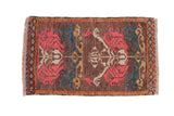 Distressed Turkish Kars rug with rose motifs, teal accents, and a diamond detail border.