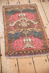 A high-angle view of the vintage Kars rug mat, highlighting its decorative, even wear.