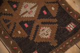 Angled view showing the even wear to the knot heads on a geometric Turkish Kars rug.
